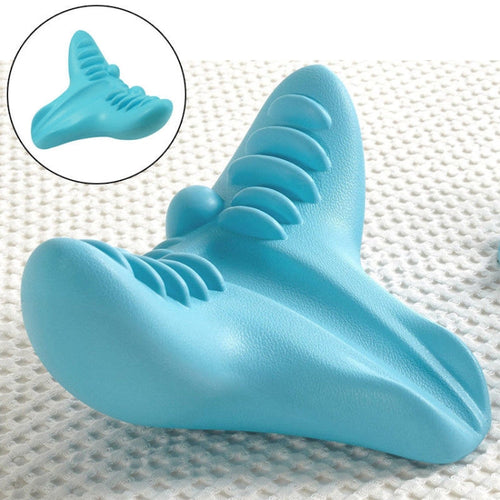 Blue shark-shaped object on a textured white background