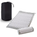 Acupressure mat with roller and black carrying bag on a white background
